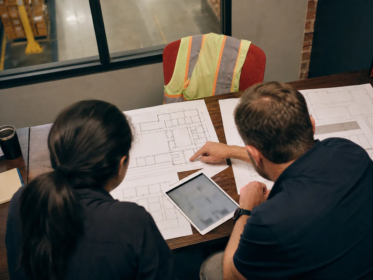 Logistics team reviewing supply chain plans together in a working session
